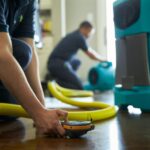 two workers restoring water damage in Little Elm