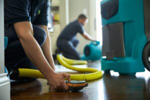 two workers restoring water damage in Little Elm